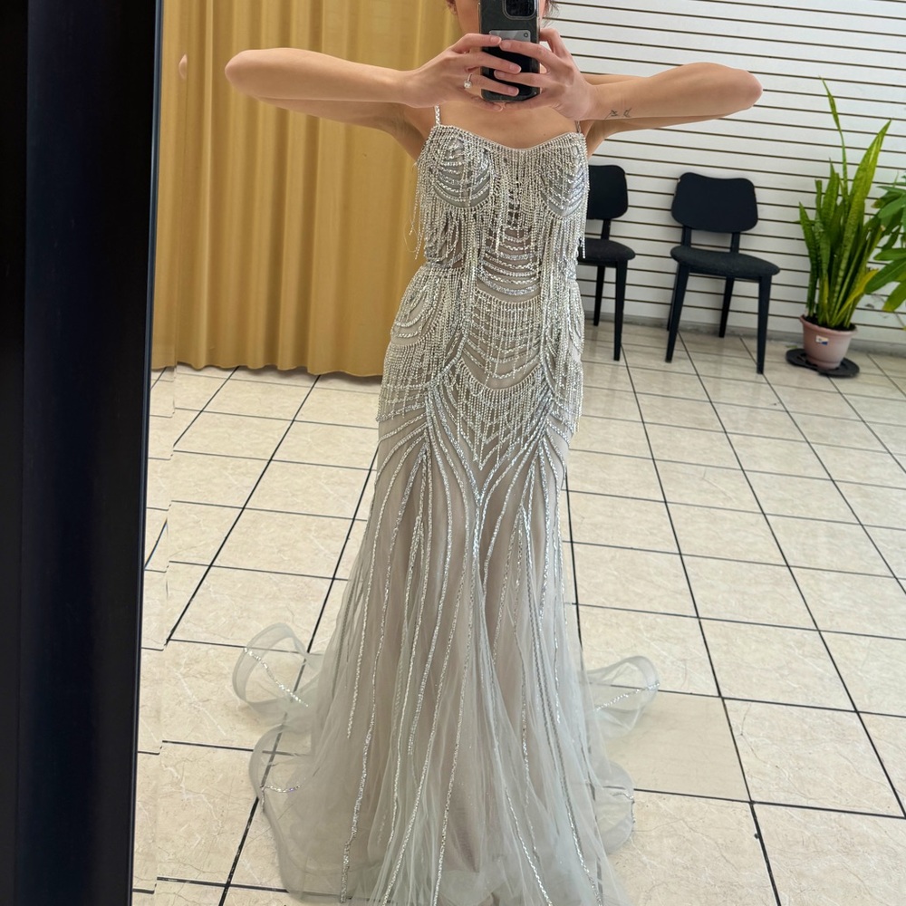 New elegant, beautiful, and shimmery silver dress with stones